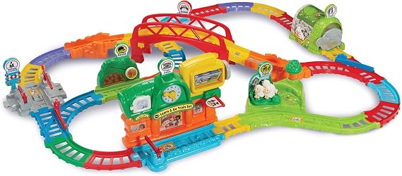 Vtech Toot-Toot Drivers Learn & Go Train Set, English | Motorised train visits 6 interactive destinations, with 6 SmartPoints triggering phrases, music and songs. Ages 1-5